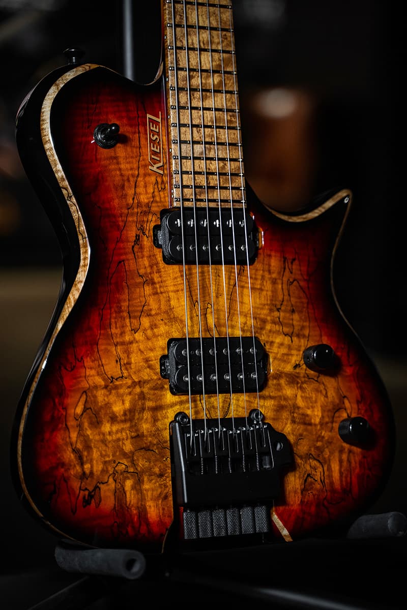 Kiesel Guitars Leia tremolo L6X with black back and sides, spalted maple top, traditional sunburst finish, black hardware, roasted birdseye maple fingerboard, gold logo